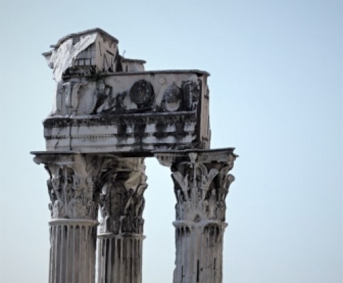 Capitols and the entablature of the Temple of Vespasian and Titus at Forum Romanum