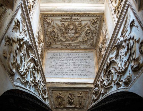 Tempietto, dedicative inscription and bas-relief – Virgin Mary among saints (Franciscans), crypt