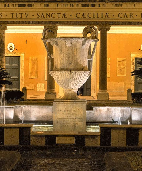 Fountain in front of the Basilica of Santa Cecilia, arrangements from the XX century