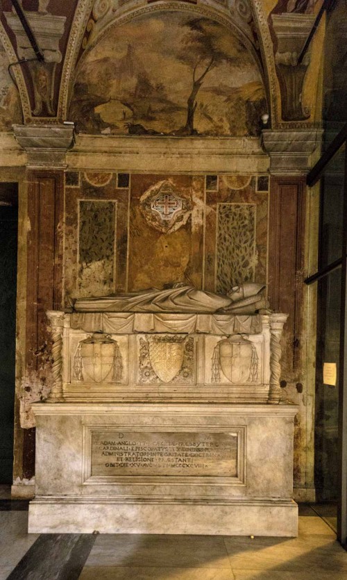 Basilica of Santa Cecilia, tombstone of Adam Easton, frescoes of the church vestibule in the background