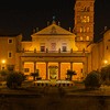 Façade of the Basilica of Santa Cecilia from the XVIII century and bell tower from the XII century