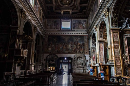 Church of San Marcello, interior with a view of the main enterance, in the lintel scene of the Crucifixion, Giovanni Battista Ricci