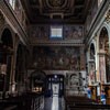 Church of San Marcello, interior with a view of the main enterance, in the lintel scene of the Crucifixion, Giovanni Battista Ricci