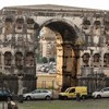 Arch of Janus seen from the Church of San Giorgio in Velabro, Temple of Portunus in the background