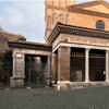 Portico of the Church of San Giorgio in Velabro with the Arch of the Silversmiths next to it