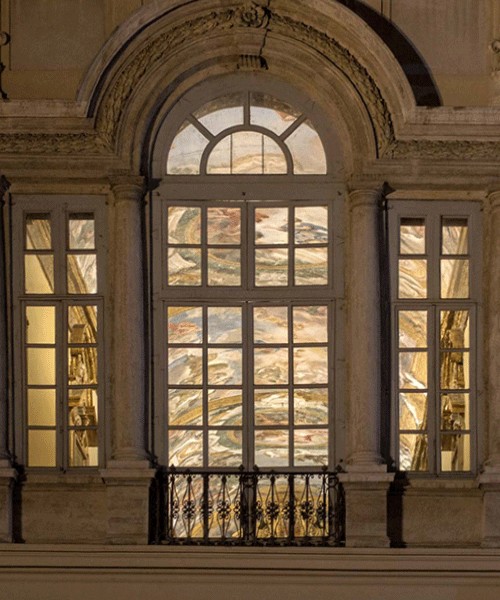 Palazzo Pamphilj, Galleria Serliana at night, view from Piazza Navona