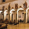 Church of Santa Prisca, view of the nave with paintings above the arcades – saints and angels with tools of the Suffering of Christ