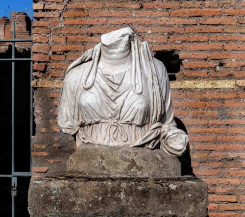 Fragment of a statue of one of the Vestals in the atrium of the House of the Vestals at the Temple of Vesta