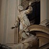 Attributed to Antonio Raggi figure of St. Francis above the enterance to the Church of San Francesco dei Stigmati