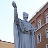 Statue of St. Charles Borromeo next to the apse of the Church of San Carlo al Corso