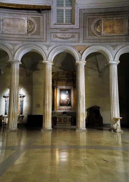 Basilica of San Pietro in Vincoli, row of Doric columns from the V century, the Altar of St. Augustine in the  background