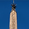 Macuteo Obelisk topped off with a cross and star of Clement XI