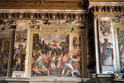 Basilica of Santi Cosma e Damiano, frieze under the ceiling with the story of the first martyrs, XVIII century