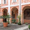 Church of Santi Cosma e Damiano, monastery courtyard with Baroque frescoes