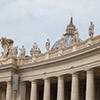 The attic crowning the colonnade designed by Gian Lorenzo Bernini