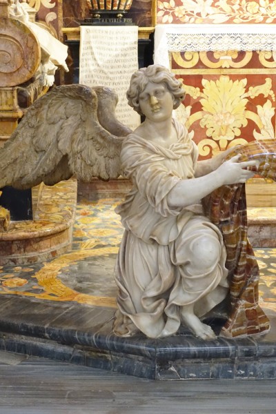 Spada Chapel, an angel supporting the cloth at the entrance to the chapel, Church of San Girolamo della Carità