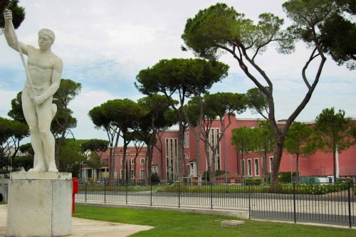 Foro Italico, statue adorning the tennis court, in the background facilities of the swimming center