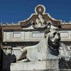 Piazza del Popolo, Lion from the fountain at the Flaminio Obelisk, Porta del Popolo in the background
