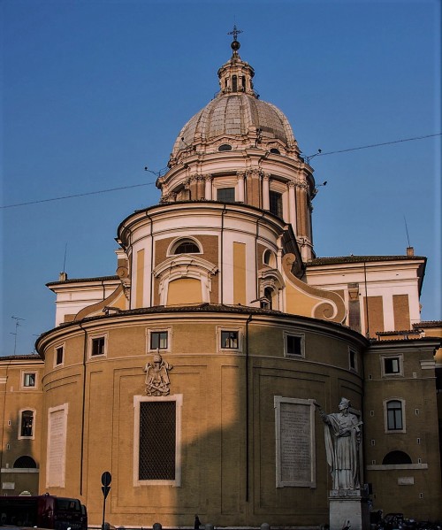 Statue of St. Charles Borromeo with the apse of the Church of San Carlo al Corso in the background