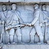 Ponte Duca d'Aosta, one of the bas-reliefs with an inscription highlighting the determination of Italian soldiers in the struggle against the  enemy