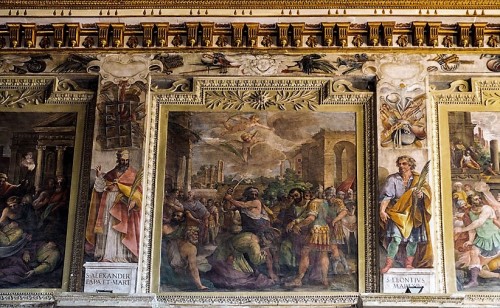 Basilica of Santi Cosma e Damiano, frieze under the ceiling with the story of the first martyrs, XVIII century
