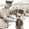 Mussolini decorates a boy from the fascist ranks, pic. Wikipedia