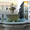 One of the two fountains in Piazza Farnese, in front of Palazzo Farnese, on the right - the facade of the Church of Santa Brigida
